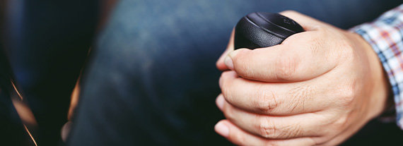 man holding vehicle gear shift